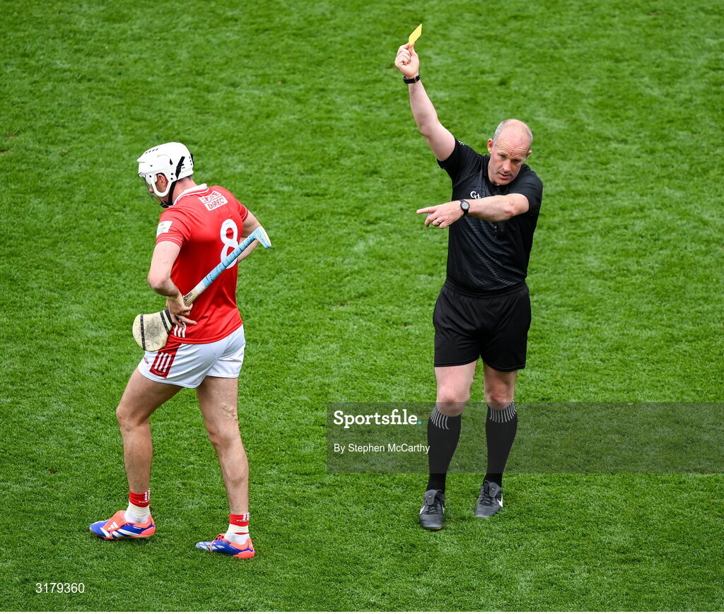 5 July 2025; Darragh Fitzgibbon of Cork is shown a yellow card by referee Johnny Murphy during the GAA Hurling All-Ireland Senior Championship semi-final match between Cork and Dublin at Croke Park in Dublin. Photo by Stephen McCarthy/Sportsfile