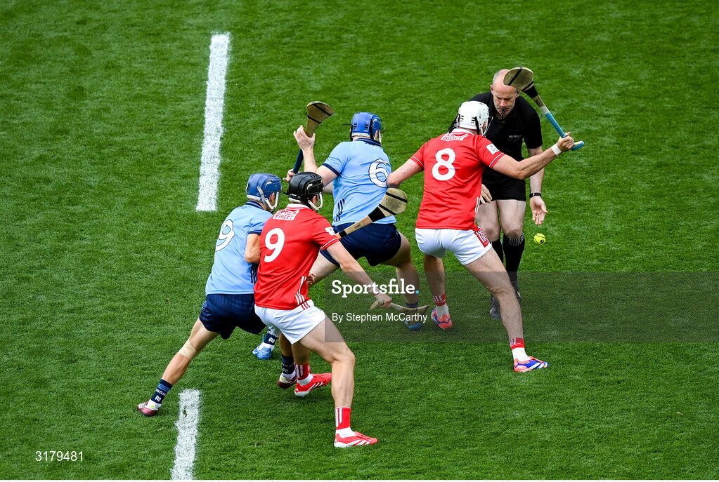 5 July 2025; Referee Johnny Murphy throws the sliothár in between Conor Burke, 6, Brian Hayes, 9 of Dublin, Tim O'Mahony, 8 and Darragh Fitzgibbon, 9, of Cork to start the GAA Hurling All-Ireland Senior Championship semi-final match between Cork and Dublin at Croke Park in Dublin. Photo by Stephen McCarthy/Sportsfile