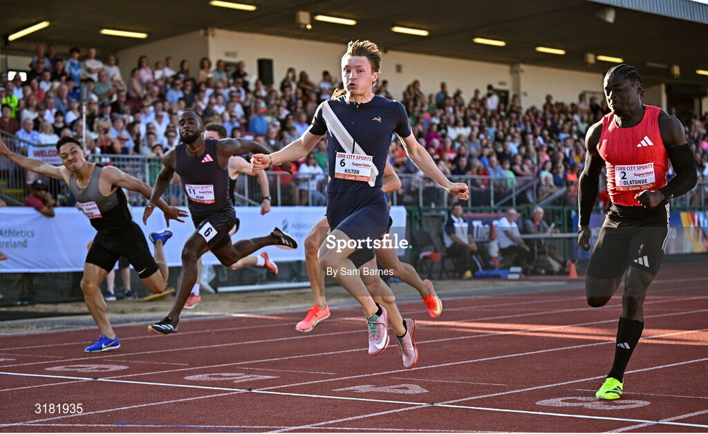 9 July 2025; Coby Hilton of USA, centre, finishes in first place ahead of Israel Olatunde of Ireland, right, who finished second, in the SuperValu Men's 100m Race 2 during the Cork City Sports meet at MTU Arena in Cork. Photo by Sam Barnes/Sportsfile