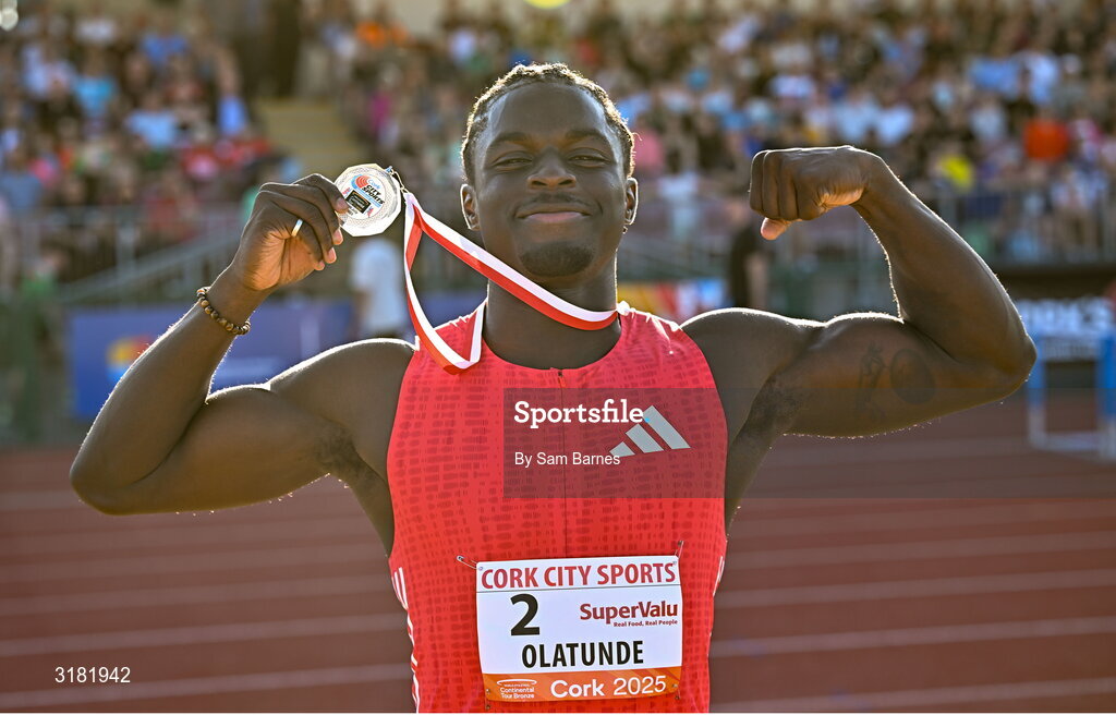 9 July 2025; Israel Olatunde of Ireland celebrates with his silver medal after finishing second in the SuperValu Men's 100m Race 2 during the Cork City Sports meet at MTU Arena in Cork. Photo by Sam Barnes/Sportsfile Photo by Sam Barnes/Sportsfile