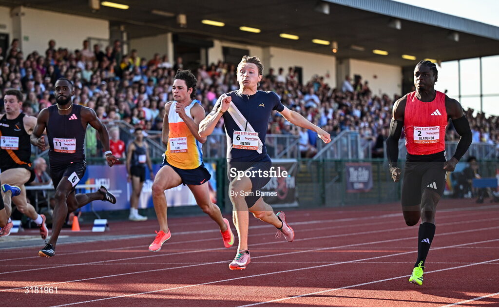 9 July 2025; Coby Hilton of USA, centre, finishes in first place ahead of Israel Olatunde of Ireland, right, who finished second, in the SuperValu Men's 100m Race 2 during the Cork City Sports meet at MTU Arena in Cork. Photo by Sam Barnes/Sportsfile