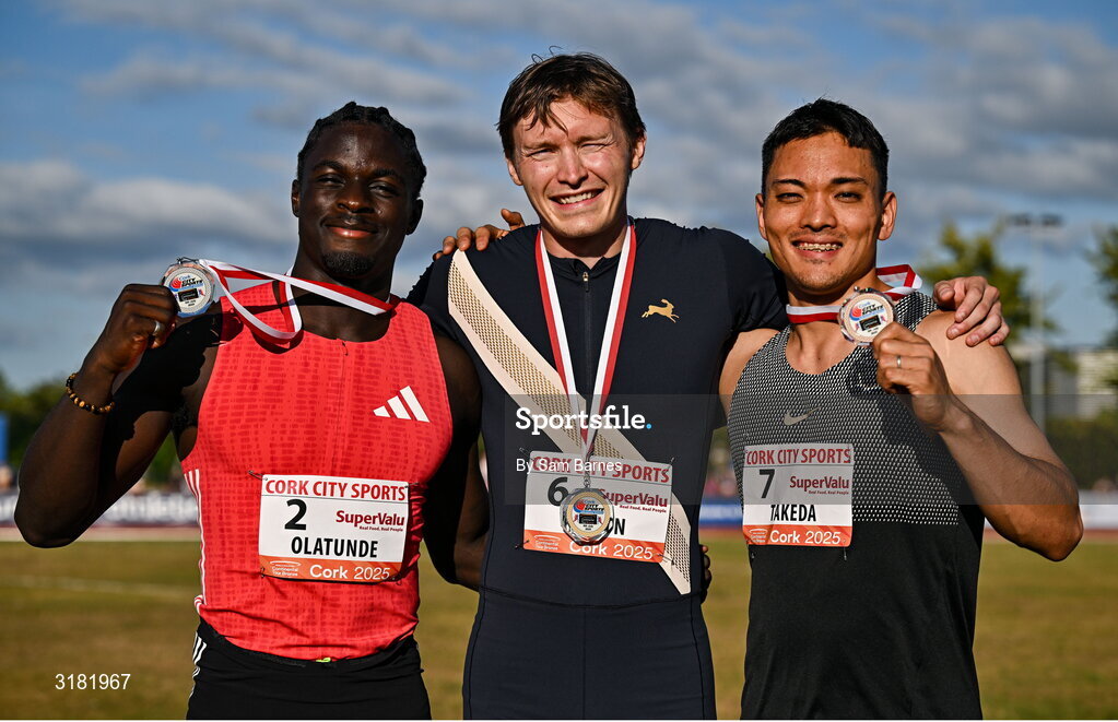9 July 2025; Coby Hilton of USA, centre, with his gold medal, alongside Israel Olatunde of Ireland, left, with his silver medal, and Ippei Takeda of Japan, with his bronze medal, after competin in the SuperValu Men's 100m Race 2 during the Cork City Sports meet at MTU Arena in Cork. Photo by Sam Barnes/Sportsfile