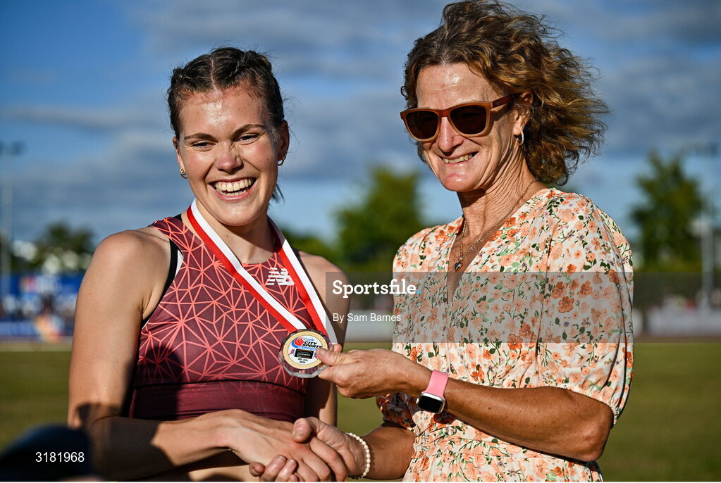 9 July 2025; Megan Keith of Great Britain, left, is presented with her gold medal by Olympian Sonia O'Sullivan after winning the PJ Hegarty Women's 3000m during the Cork City Sports meet at MTU Arena in Cork. Photo by Sam Barnes/Sportsfile