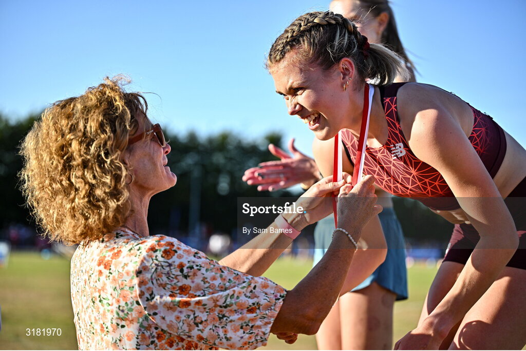 9 July 2025; Megan Keith of Great Britain, right, is presented with her gold medal by Olympian Sonia O'Sullivan after winning the PJ Hegarty Women's 3000m during the Cork City Sports meet at MTU Arena in Cork. Photo by Sam Barnes/Sportsfile