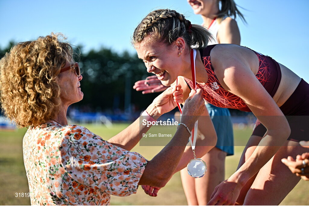 9 July 2025; Megan Keith of Great Britain, right, is presented with her gold medal by Olympian Sonia O'Sullivan after winning the PJ Hegarty Women's 3000m during the Cork City Sports meet at MTU Arena in Cork. Photo by Sam Barnes/Sportsfile