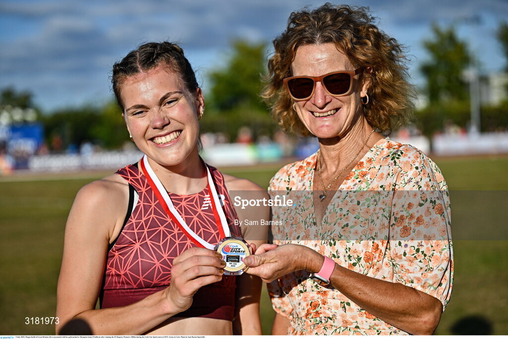 9 July 2025; Megan Keith of Great Britain, left, is presented with her gold medal by Olympian Sonia O'Sullivan after winning the PJ Hegarty Women's 3000m during the Cork City Sports meet at MTU Arena in Cork. Photo by Sam Barnes/Sportsfile