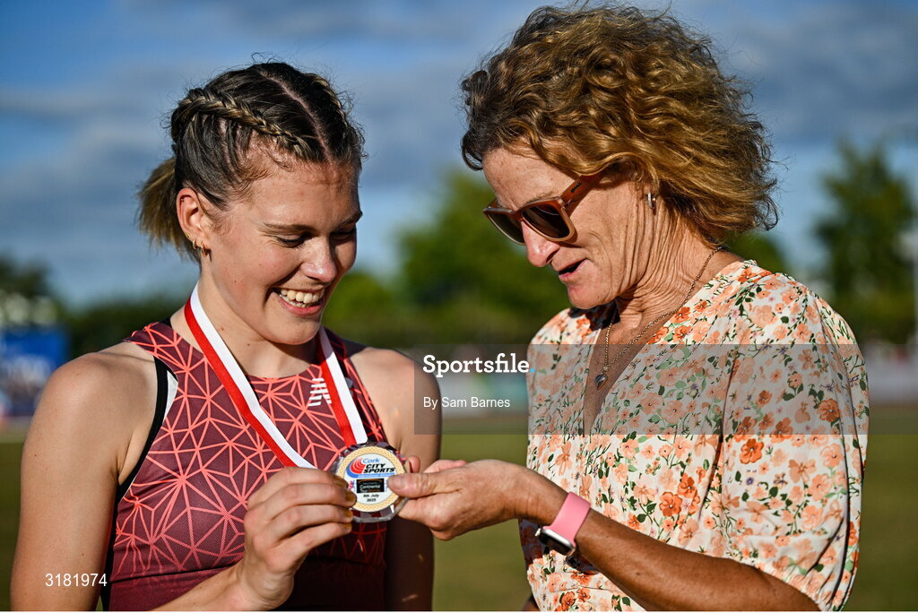 9 July 2025; Megan Keith of Great Britain, left, is presented with her gold medal by Olympian Sonia O'Sullivan after winning the PJ Hegarty Women's 3000m during the Cork City Sports meet at MTU Arena in Cork. Photo by Sam Barnes/Sportsfile