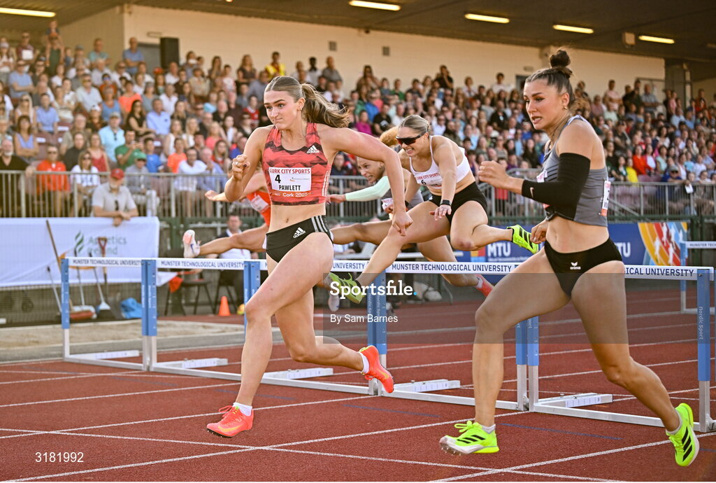 9 July 2025; Abigail Pawlett of Great Britain, left, competes in the Athletics Ireland Women's 100m Hurdles during the Cork City Sports meet at MTU Arena in Cork. Photo by Sam Barnes/Sportsfile