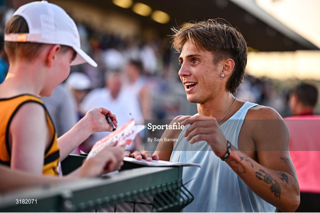 9 July 2025; Marco Langon of USA signs autographs for supporters after winning the Cork City Council Men's Mile during the Cork City Sports meet at MTU Arena in Cork. Photo by Sam Barnes/Sportsfile