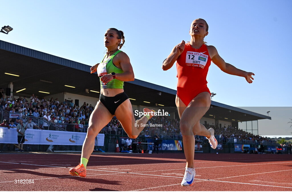 9 July 2025; Sarah Leahy of Ireland, left, and Molly Scott of Ireland compete in the Centra Women's 100m during the Cork City Sports meet at MTU Arena in Cork. Photo by Sam Barnes/Sportsfile