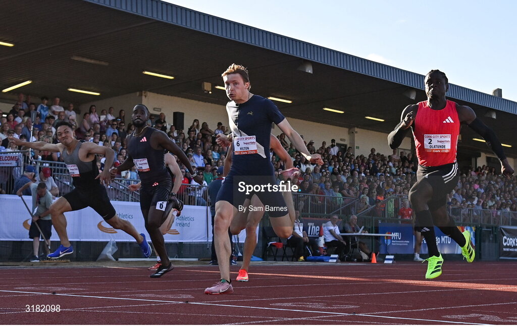 9 July 2025; Coby Hilton of USA, centre, finishes in first place ahead of Israel Olatunde of Ireland, right, who finished second, in the SuperValu Men's 100m Race 2 during the Cork City Sports meet at MTU Arena in Cork. Photo by Sam Barnes/Sportsfile