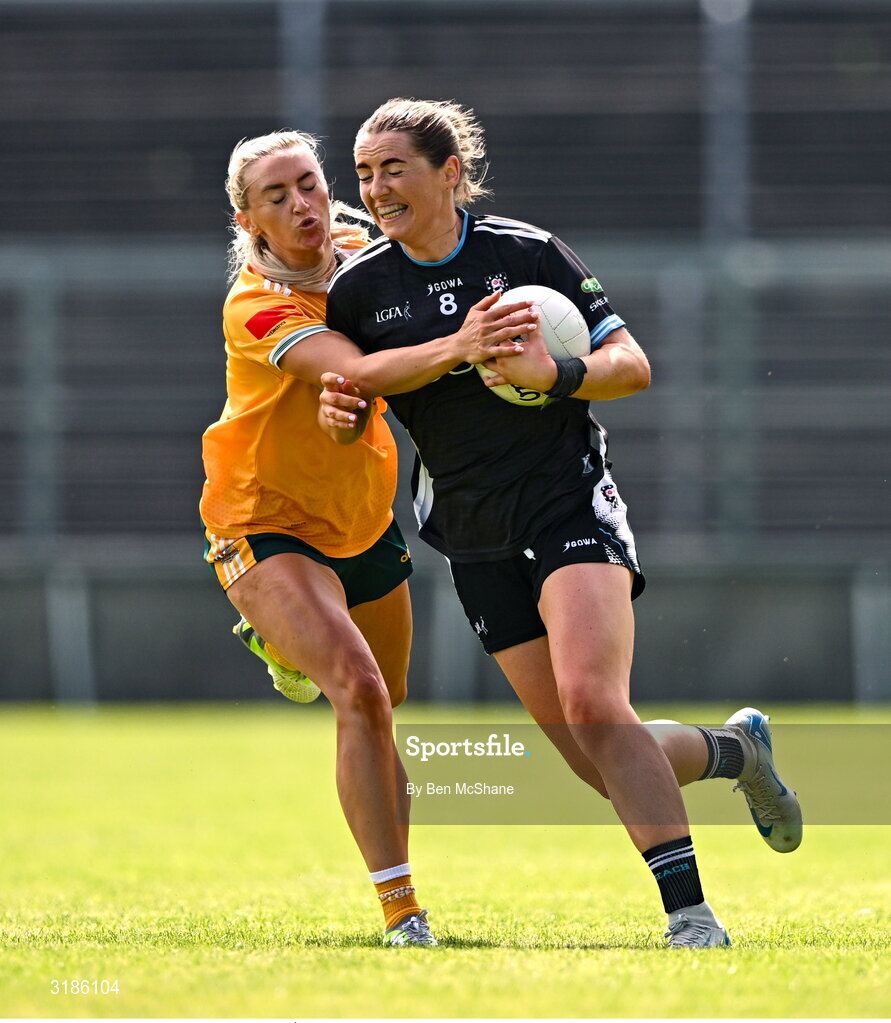 13 July 2025; Sinéad Regan of Sligo is tackled by Áine Tubridy of Antrim during the TG4 All-Ireland Ladies Football Junior Championship semi-final match between Antrim and Sligo at St Tiernach’s Park in Clones, Monaghan. Photo by Ben McShane/Sportsfile