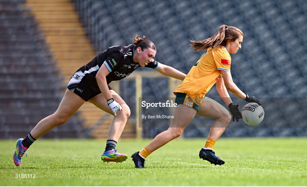 13 July 2025; Niamh McIntosh of Antrim in action against Cora Gilligan of Sligo during the TG4 All-Ireland Ladies Football Junior Championship semi-final match between Antrim and Sligo at St Tiernach’s Park in Clones, Monaghan. Photo by Ben McShane/Sportsfile