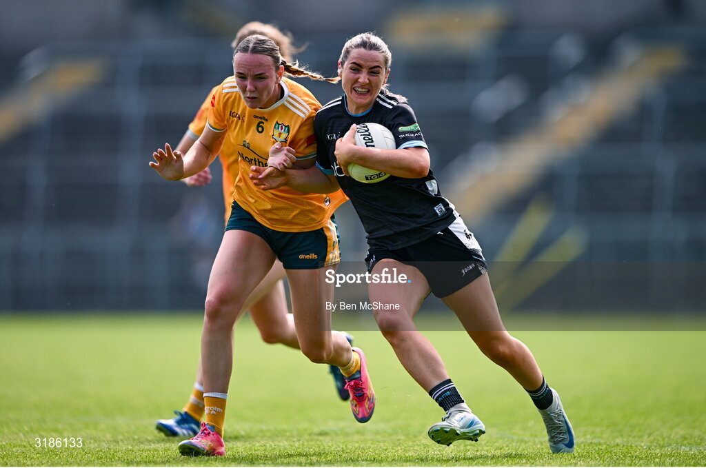 13 July 2025; Sinéad Regan of Sligo is tackled by Ciara Brown of Antrim during the TG4 All-Ireland Ladies Football Junior Championship semi-final match between Antrim and Sligo at St Tiernach’s Park in Clones, Monaghan. Photo by Ben McShane/Sportsfile
