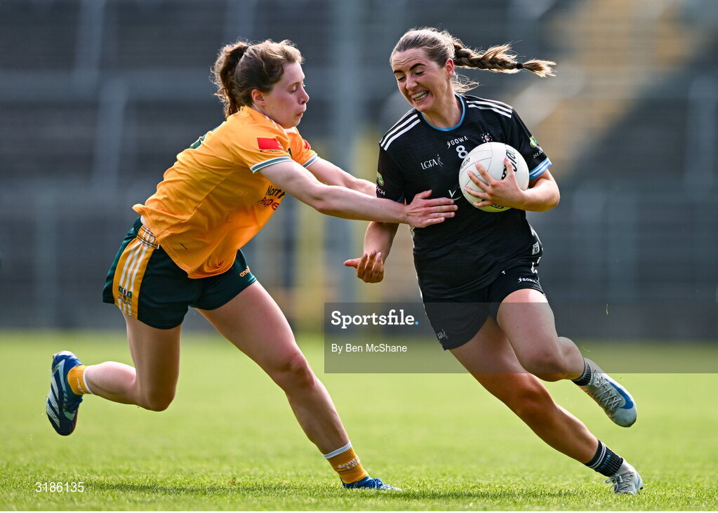 13 July 2025; Sinéad Regan of Sligo is tackled by Laura Agnew of Antrim during the TG4 All-Ireland Ladies Football Junior Championship semi-final match between Antrim and Sligo at St Tiernach’s Park in Clones, Monaghan. Photo by Ben McShane/Sportsfile