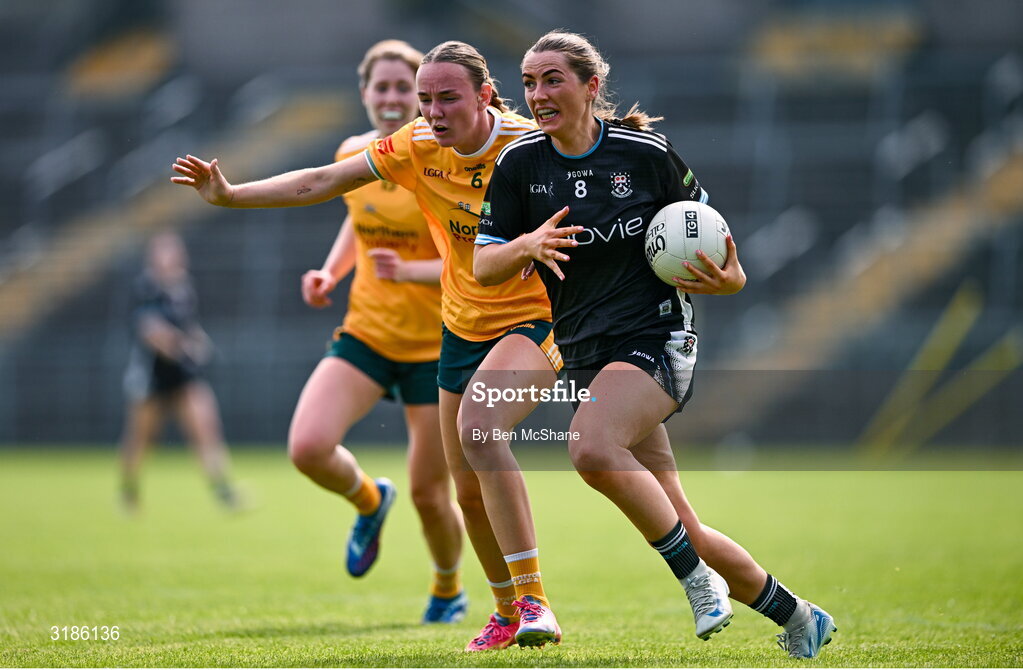 13 July 2025; Sinéad Regan of Sligo is tackled by Ciara Brown of Antrim during the TG4 All-Ireland Ladies Football Junior Championship semi-final match between Antrim and Sligo at St Tiernach’s Park in Clones, Monaghan. Photo by Ben McShane/Sportsfile