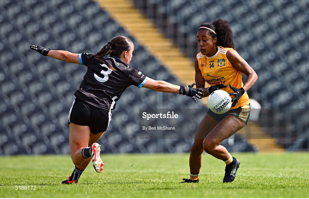 13 July 2025; Omolara Dahunsi of Antrim in action against Claire Dunne of Sligo during the TG4 All-Ireland Ladies Football Junior Championship semi-final match between Antrim and Sligo at St Tiernach’s Park in Clones, Monaghan. Photo by Ben McShane/Sportsfile