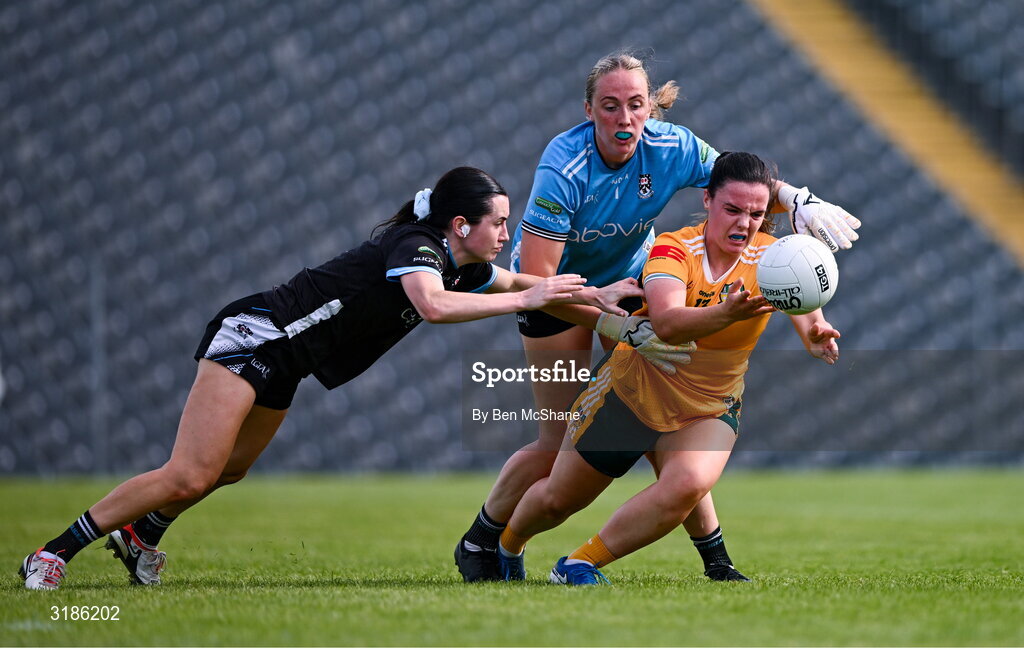 13 July 2025; Bronagh Devlin of Antrim is tackled by Hannah Walsh, left, and Sligo goalkeeper Ellen Maguire during the TG4 All-Ireland Ladies Football Junior Championship semi-final match between Antrim and Sligo at St Tiernach’s Park in Clones, Monaghan. Photo by Ben McShane/Sportsfile