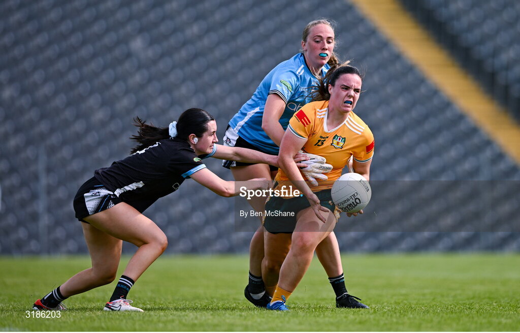 13 July 2025; Bronagh Devlin of Antrim is tackled by Hannah Walsh, left, and Sligo goalkeeper Ellen Maguire during the TG4 All-Ireland Ladies Football Junior Championship semi-final match between Antrim and Sligo at St Tiernach’s Park in Clones, Monaghan. Photo by Ben McShane/Sportsfile
