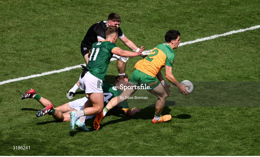 13 July 2025; Finnbarr Roarty of Donegal in action against Meath players, left to right, Ruairí Kinsella, Billy Hogan, and Ronan Ryan during the GAA Football All-Ireland Senior Championship semi-final match between Meath and Donegal at Croke Park in Dublin. Photo by Daire Brennan/Sportsfile