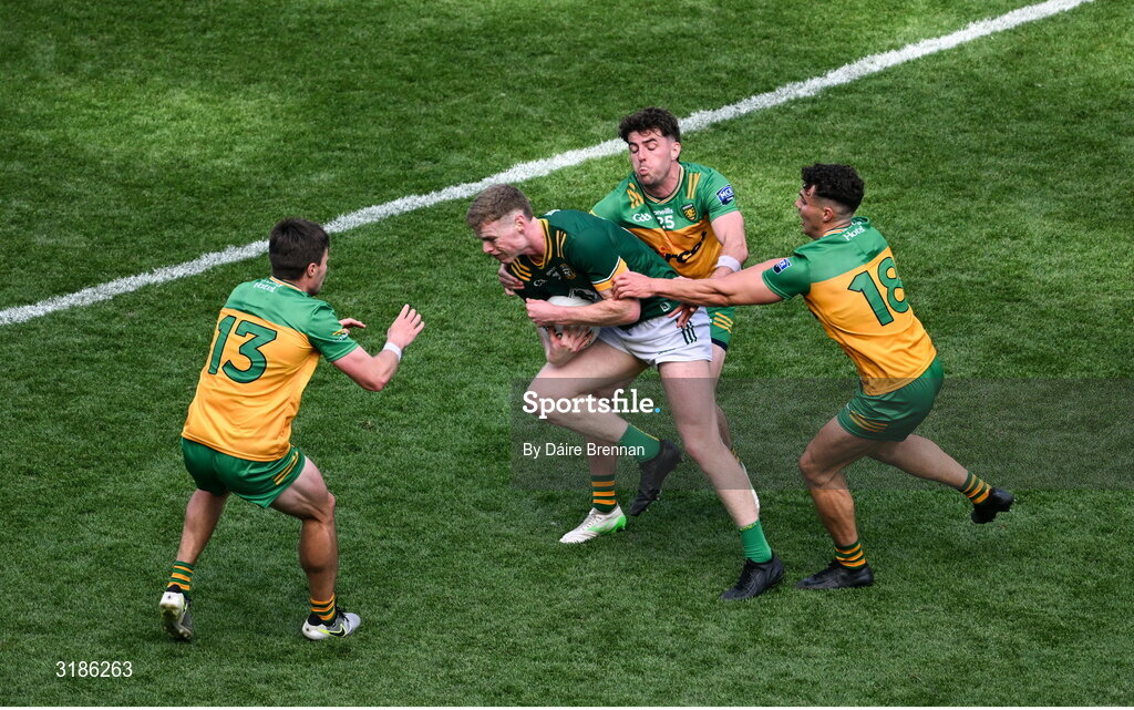 13 July 2025; Mathew Costello of Meath in action against Donegal players, left to right, Ciaran Moore, Odhran McFadden Ferry, and Conor O'Donnell during the GAA Football All-Ireland Senior Championship semi-final match between Meath and Donegal at Croke Park in Dublin. Photo by Daire Brennan/Sportsfile
