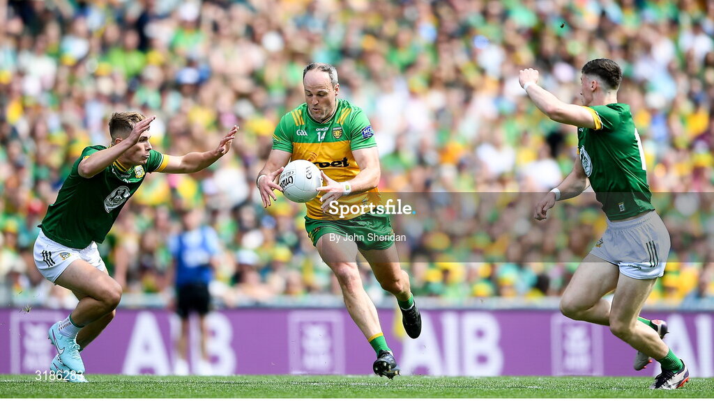 13 July 2025; Michael Murphy of Donegal is tackled by Meath players, from left, Ciaran Thompson and Shane O'Donnell  during the GAA Football All-Ireland Senior Championship semi-final match between Meath and Donegal at Croke Park in Dublin. Photo by John Sheridan/Sportsfile