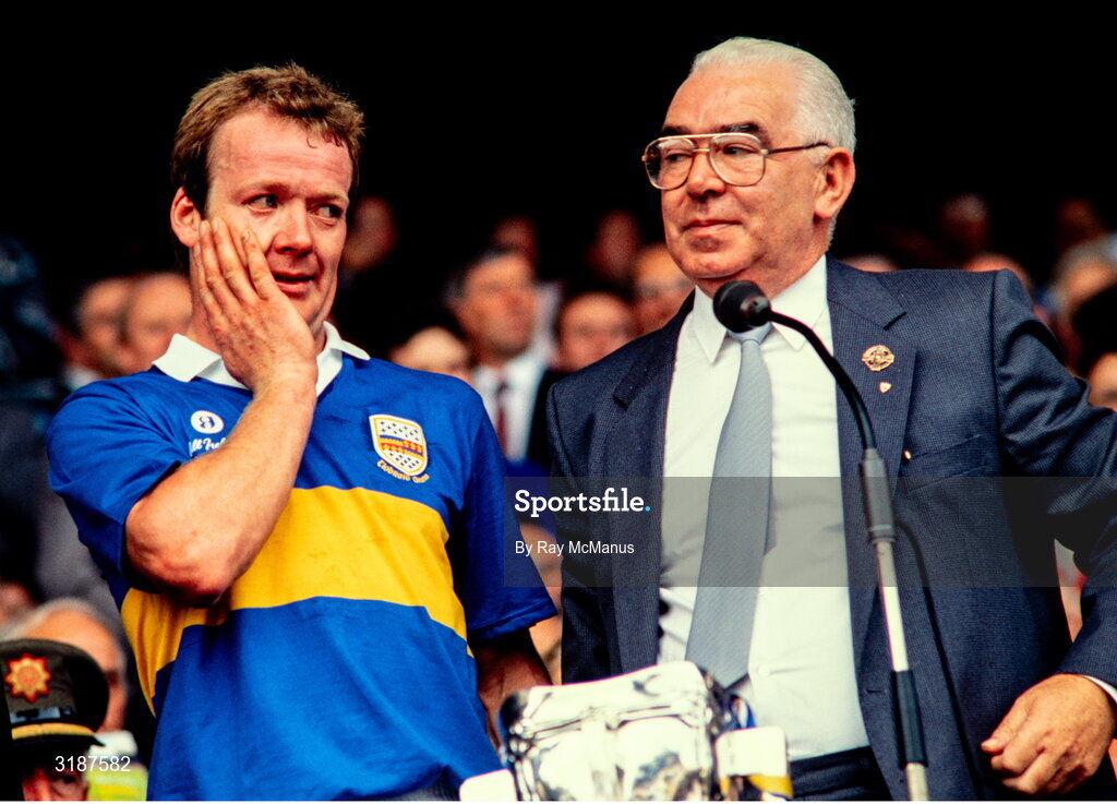 3 September 1989; Tipperary captain Bobby Ryan with GAA President John Dowling before being presented with the Liam MacCarthy Cup after his side's victory during the All-Ireland Senior Hurling Championship Final match between Tipperary and Antrim at Croke Park in Dublin. Photo by Ray McManus/Sportsfile