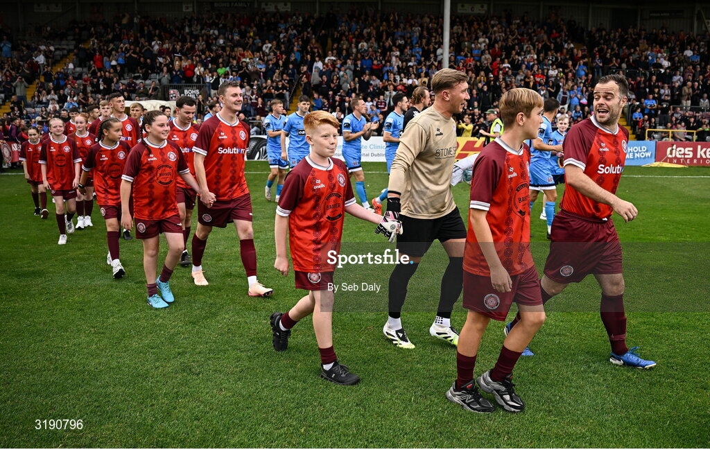 18 July 2025; Killester Donnycarney captain Stephen Chambers leads his side out before the Sports Direct Men’s FAI Cup second round match between Killester Donnycarney and Bohemians at Dalymount Park in Dublin. Photo by Seb Daly/Sportsfile