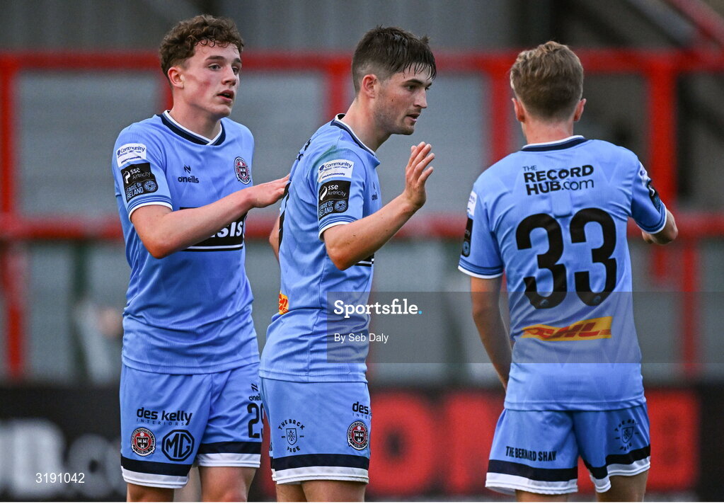 18 July 2025; Colm Whelan of Bohemians, centre, celebrates with teammates Josh Harper, left, and Christopher Conlan after scoring their side's seventh goal during the Sports Direct Men’s FAI Cup second round match between Killester Donnycarney and Bohemians at Dalymount Park in Dublin. Photo by Seb Daly/Sportsfile
