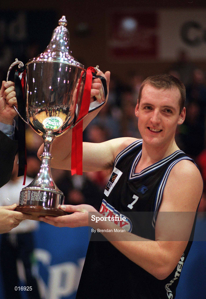 25 January 1998; Denny Notre Dame captain Albert Carrigan lifts the cup following the Senior Men's Sprite National Cup Final between Denny Notre Dame and Neptune at the National Basketball Arena in Tallaght, Dublin. Photo By Brendan Moran/Sportsfile.