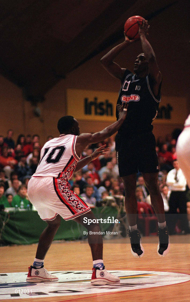 25 January 1998; Daniel Johnson of Denny Notre Dame shoots for a basket despite the attentions of Harold Joiner of Neptune during the Senior Men's Sprite National Cup Final between Denny Notre Dame and Neptune at the National Basketball Arena in Tallaght, Dublin. Photo By Brendan Moran/Sportsfile.