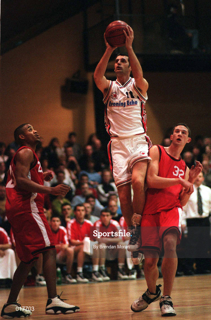 24 January 1998; Tom O'Sullivan of Neptune shoots for a basket depsite the attentions of Reggie Brown, left, and Neil Maguire of Tolka Rovers during the Senior Men's Sprite National Cup Semi-Final between Neptune and Tolka Rovers at the National Basketball Arena in Tallaght, Dublin. Photo by Brendan Moran/Sportsfile.