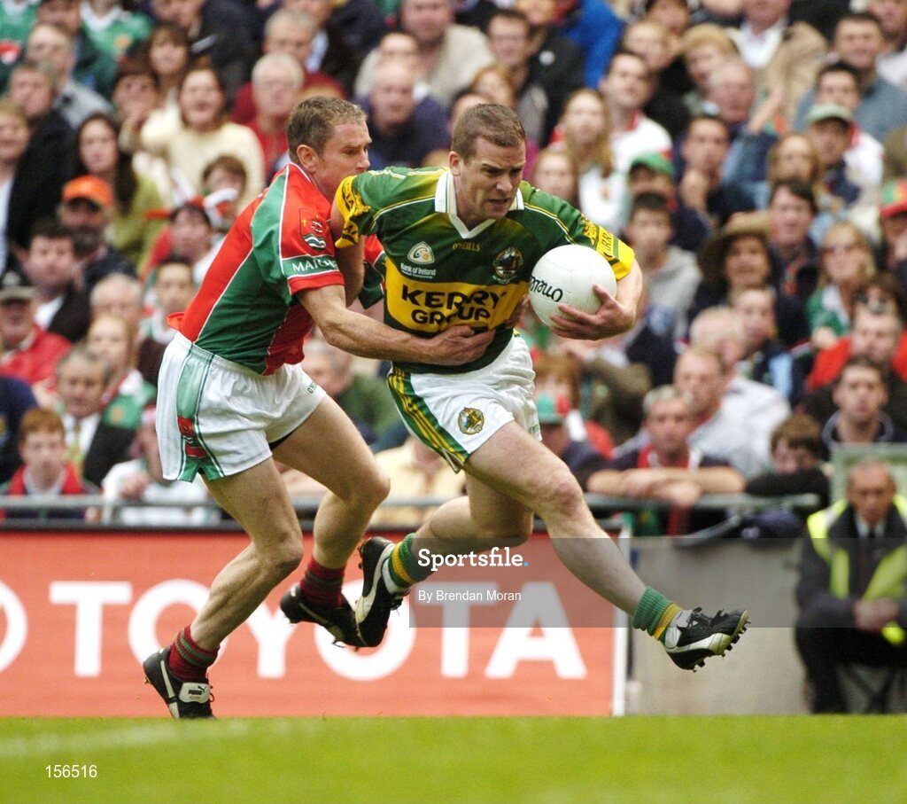 26 September 2004; Dara O Cinneide, Kerry, in action against Gary Ruane, Mayo. Bank of Ireland All-Ireland Senior Football Championship Final, Kerry v Mayo, Croke Park, Dublin. Picture credit; Brendan Moran / SPORTSFILE *** Local Caption *** Any photograph taken by SPORTSFILE during, or in connection with, the 2004 Bank of Ireland All-Ireland Senior Football Final which displays GAA logos or contains an image or part of an image of any GAA intellectual property, or, which contains images of a GAA player/players in their playing uniforms, may only be used for editorial and non-advertising purposes.  Use of photographs for advertising, as posters or for purchase separately is strictly prohibited unless prior written approval has been obtained from the Gaelic Athletic Association.