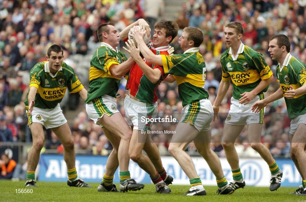 26 September 2004; Ronan McGarrity, Mayo, in action against, from left, Tom O'Sullivan, William Kirby, Tomas O Se, Marc O Se and Michael McCarthy, Kerry. Bank of Ireland All-Ireland Senior Football Championship Final, Kerry v Mayo, Croke Park, Dublin. Picture credit; Brendan Moran / SPORTSFILE *** Local Caption *** Any photograph taken by SPORTSFILE during, or in connection with, the 2004 Bank of Ireland All-Ireland Senior Football Final which displays GAA logos or contains an image or part of an image of any GAA intellectual property, or, which contains images of a GAA player/players in their playing uniforms, may only be used for editorial and non-advertising purposes.  Use of photographs for advertising, as posters or for purchase separately is strictly prohibited unless prior written approval has been obtained from the Gaelic Athletic Association.
