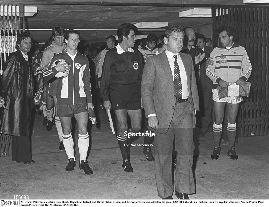 28 October 1980; Team captains Liam Brady, Republic of Ireland, and Michel Platini, France, lead their respective teams out before the game. 1982 FIFA World Cup Qualifier, France v Republic of Ireland, Parc de Princes, Paris, France. Picture credit; Ray McManus / SPORTSFILE