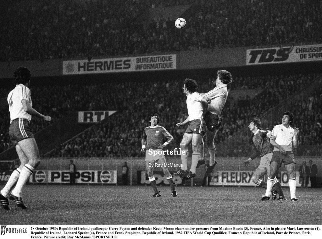 28 October 1980; Republic of Ireland goalkeeper Gerry Peyton and defender Kevin Moran clears under pressure from Maxime Bossis (3), France. Also in pic are Mark Lawrenson (4), Republic of Ireland, Leonard Specht (4), France and Frank Stapleton, Republic of Ireland. 1982 FIFA World Cup Qualifier, France v Republic of Ireland, Parc de Princes, Paris, France. Picture credit; Ray McManus / SPORTSFILE