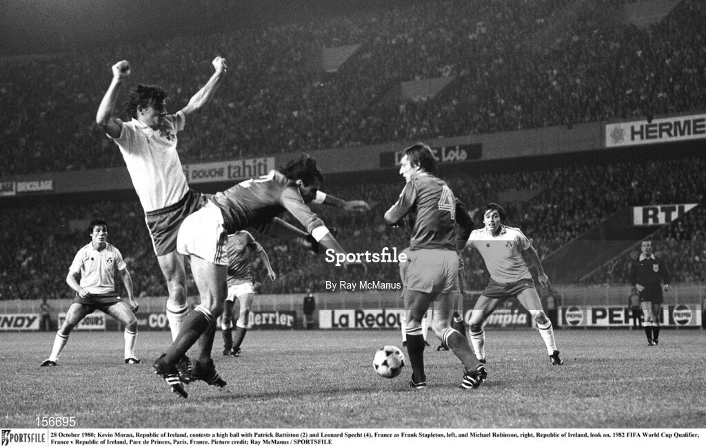 28 October 1980; Kevin Moran, Republic of Ireland, contests a high ball with Patrick Battiston (2) and Leonard Specht (4), France as Frank Stapleton, left, and Michael Robinson, right, Republic of Ireland, look on. 1982 FIFA World Cup Qualifier, France v Republic of Ireland, Parc de Princes, Paris, France. Picture credit; Ray McManus / SPORTSFILE