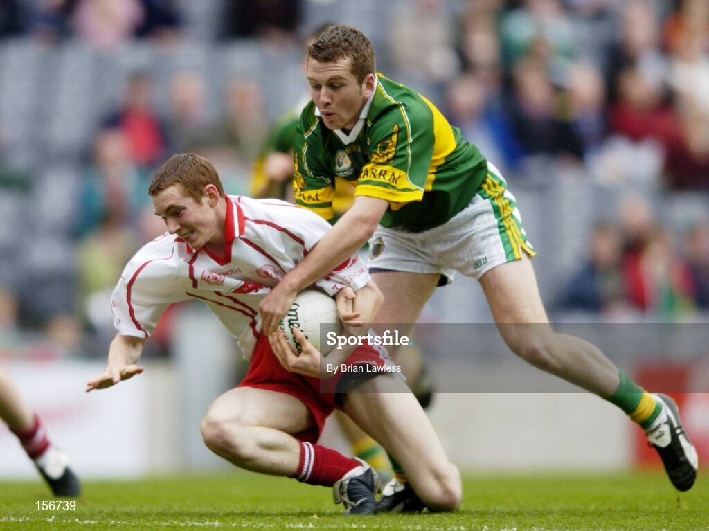 26 September 2004; Aiden Cassidy, Tyrone, in action against Luke Quinn, Kerry. All-Ireland Minor Football Championship Final, Kerry v Tyrone, Croke Park, Dublin. Picture credit; Brian Lawless / SPORTSFILE *** Local Caption *** Any photograph taken by SPORTSFILE during, or in connection with, the 2004 All-Ireland Minor Football Final which displays GAA logos or contains an image or part of an image of any GAA intellectual property, or, which contains images of a GAA player/players in their playing uniforms, may only be used for editorial and non-advertising purposes.  Use of photographs for advertising, as posters or for purchase separately is strictly prohibited unless prior written approval has been obtained from the Gaelic Athletic Association.
