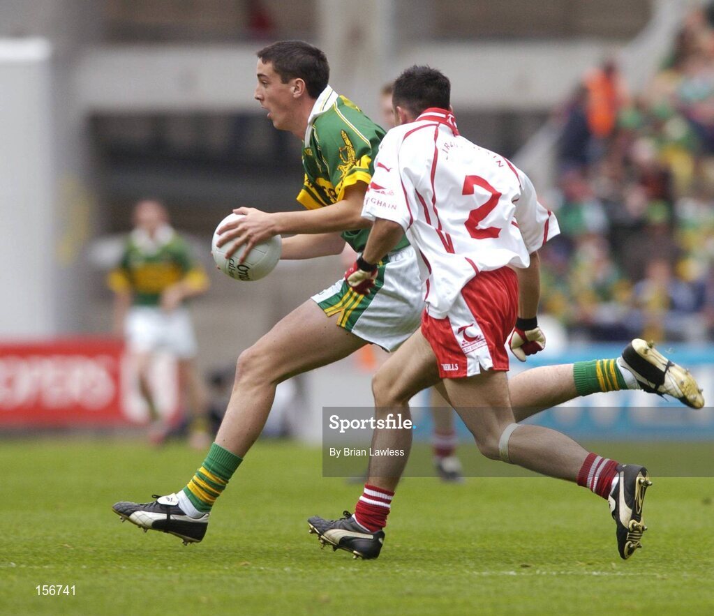 26 September 2004; Anthony Maher, Kerry, in action against Niall McGinn, Tyrone. All-Ireland Minor Football Championship Final, Kerry v Tyrone, Croke Park, Dublin. Picture credit; Brian Lawless / SPORTSFILE *** Local Caption *** Any photograph taken by SPORTSFILE during, or in connection with, the 2004 All-Ireland Minor Football Final which displays GAA logos or contains an image or part of an image of any GAA intellectual property, or, which contains images of a GAA player/players in their playing uniforms, may only be used for editorial and non-advertising purposes.  Use of photographs for advertising, as posters or for purchase separately is strictly prohibited unless prior written approval has been obtained from the Gaelic Athletic Association.