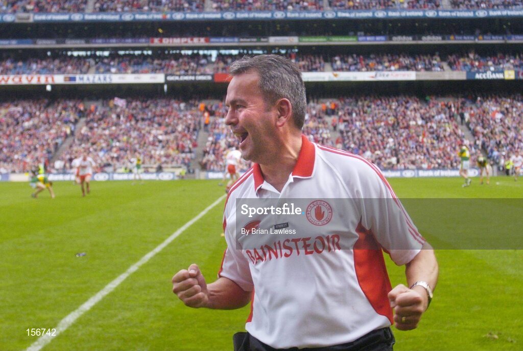 26 September 2004; Tyrone minor manager Liam Doyle celebrates at the final whistle. All-Ireland Minor Football Championship Final, Kerry v Tyrone, Croke Park, Dublin. Picture credit; Brian Lawless / SPORTSFILE *** Local Caption *** Any photograph taken by SPORTSFILE during, or in connection with, the 2004 All-Ireland Minor Football Final which displays GAA logos or contains an image or part of an image of any GAA intellectual property, or, which contains images of a GAA player/players in their playing uniforms, may only be used for editorial and non-advertising purposes.  Use of photographs for advertising, as posters or for purchase separately is strictly prohibited unless prior written approval has been obtained from the Gaelic Athletic Association.
