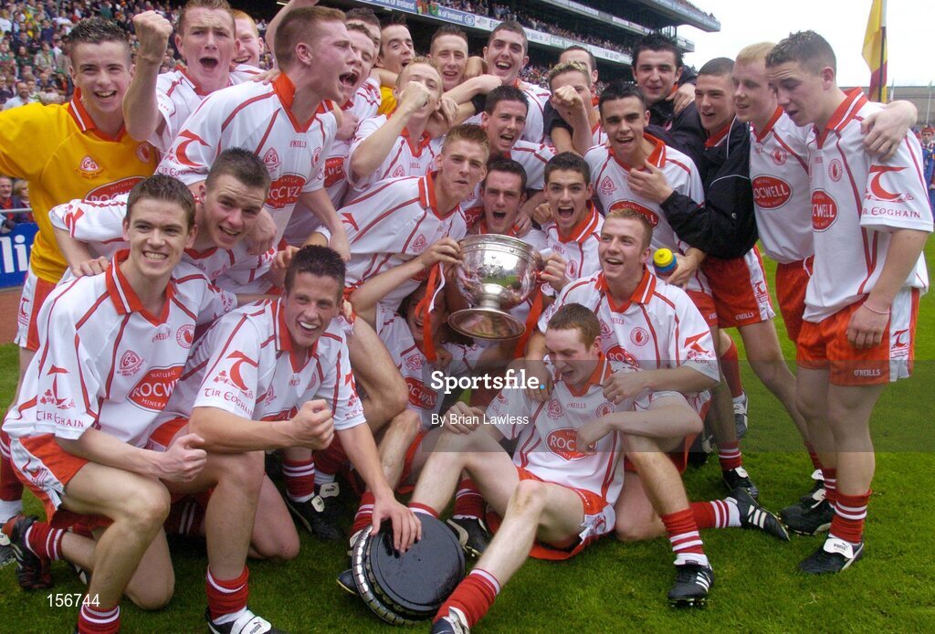 26 September 2004; The Tyrone minor team celebrate with the Tom Markham cup after victory in the final. All-Ireland Minor Football Championship Final, Kerry v Tyrone, Croke Park, Dublin. Picture credit; Brian Lawless / SPORTSFILE *** Local Caption *** Any photograph taken by SPORTSFILE during, or in connection with, the 2004 All-Ireland Minor Football Final which displays GAA logos or contains an image or part of an image of any GAA intellectual property, or, which contains images of a GAA player/players in their playing uniforms, may only be used for editorial and non-advertising purposes.  Use of photographs for advertising, as posters or for purchase separately is strictly prohibited unless prior written approval has been obtained from the Gaelic Athletic Association.