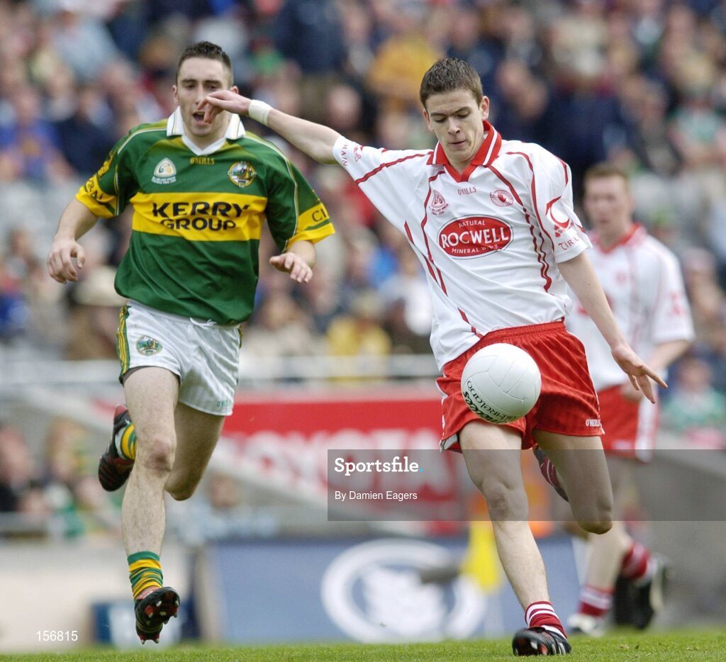 26 September 2004; Raymond Mulgrew, Tyrone, in action against Brian Moran, Kerry. All-Ireland Minor Football Championship Final, Kerry v Tyrone, Croke Park, Dublin. Picture credit; Damien Eagers / SPORTSFILE *** Local Caption *** Any photograph taken by SPORTSFILE during, or in connection with, the 2004 All-Ireland Minor  Football Final which displays GAA logos or contains an image or part of an image of any GAA intellectual property, or, which contains images of a GAA player/players in their playing uniforms, may only be used for editorial and non-advertising purposes.  Use of photographs for advertising, as posters or for purchase separately is strictly prohibited unless prior written approval has been obtained from the Gaelic Athletic Association.