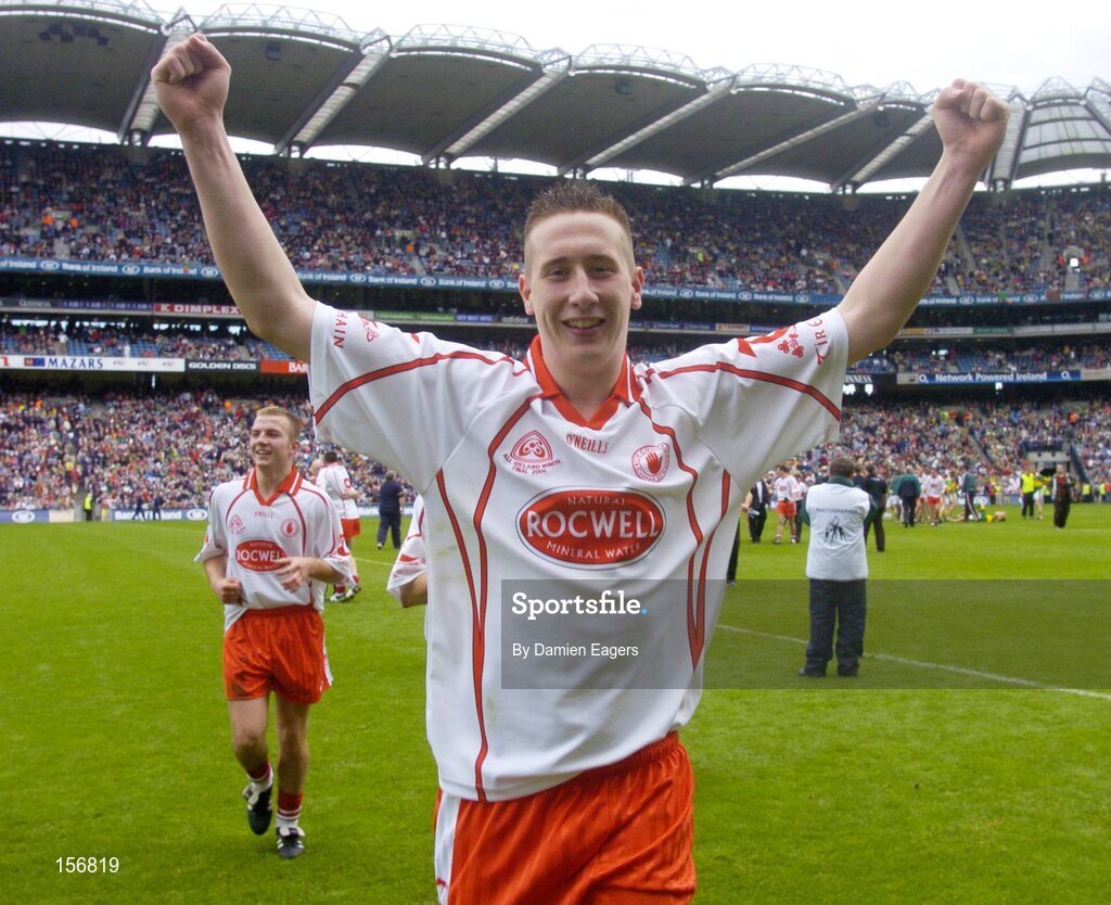 26 September 2004; Colm Cavanagh, Tyrone, celebrates after victory over Kerry. All-Ireland Minor Football Championship Final, Kerry v Tyrone, Croke Park, Dublin. Picture credit; Damien Eagers / SPORTSFILE *** Local Caption *** Any photograph taken by SPORTSFILE during, or in connection with, the 2004 All-Ireland Minor  Football Final which displays GAA logos or contains an image or part of an image of any GAA intellectual property, or, which contains images of a GAA player/players in their playing uniforms, may only be used for editorial and non-advertising purposes.  Use of photographs for advertising, as posters or for purchase separately is strictly prohibited unless prior written approval has been obtained from the Gaelic Athletic Association.