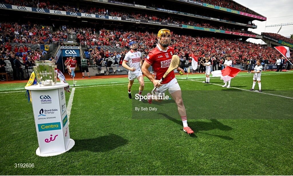 20 July 2025; Declan Dalton of Cork runs onto the pitch past the Liam MacCarthy cup before the GAA Hurling All-Ireland Senior Championship final match between Cork and Tipperary at Croke Park in Dublin. Photo by Seb Daly/Sportsfile