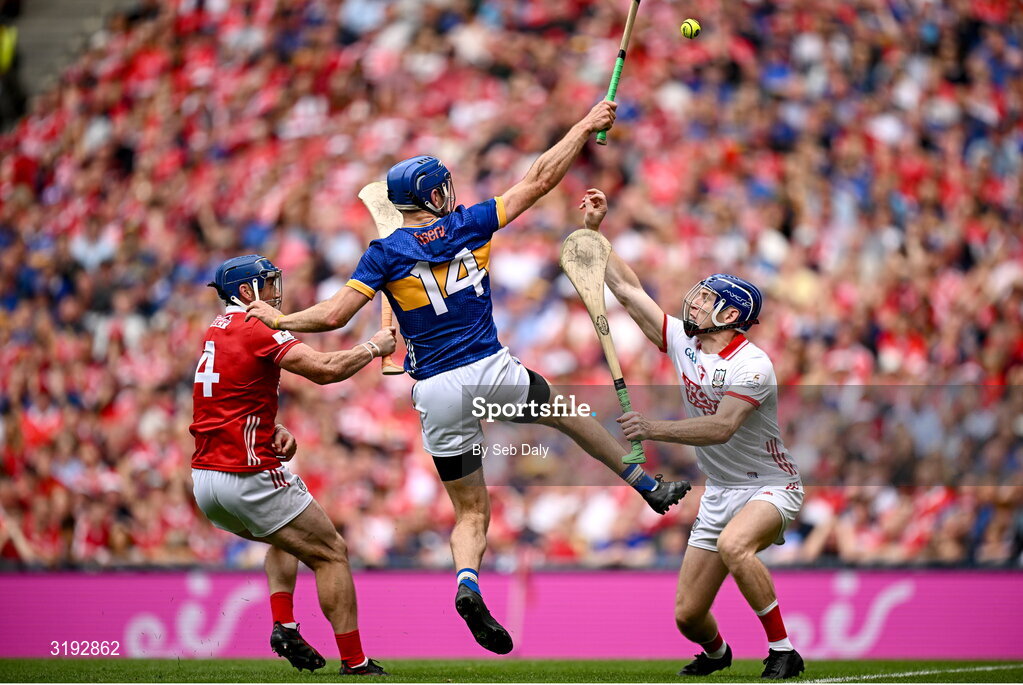 20 July 2025; John McGrath of Tipperary scores his second and his side's third goal past Cork goalkeeper Patrick Collins and Seán O'Donoghue of Cork during the GAA Hurling All-Ireland Senior Championship final match between Cork and Tipperary at Croke Park in Dublin. Photo by Seb Daly/Sportsfile