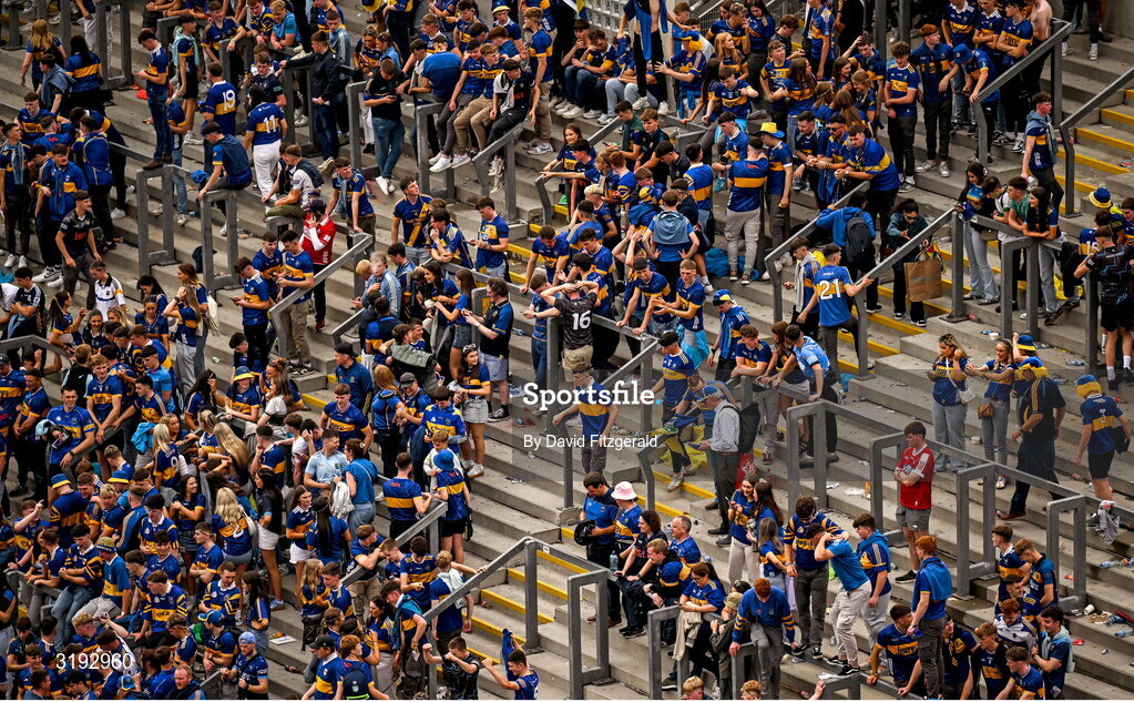 20 July 2025; A couple of Cork supporters on Hill 16 amongst jubilant Tipperary supporters after the GAA Hurling All-Ireland Senior Championship final match between Cork and Tipperary at Croke Park in Dublin. Photo by David Fitzgerald/Sportsfile