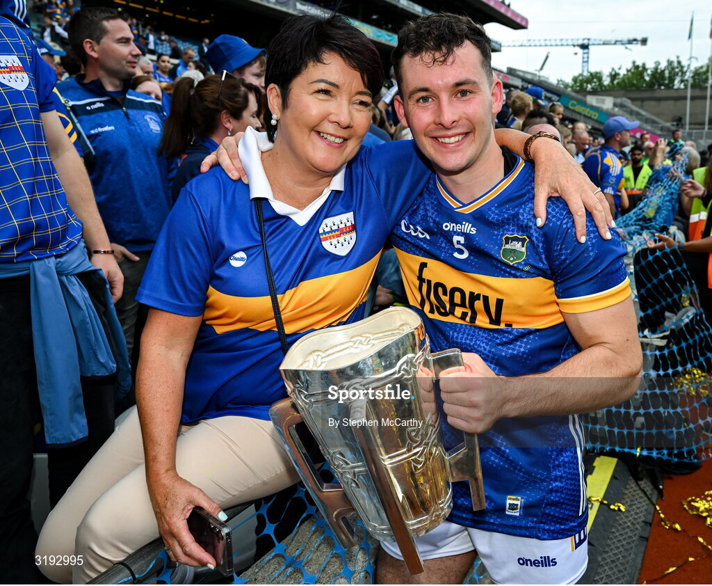 20 July 2025; Craig Morgan of Tipperary celebrates with his mother Bríd and the Liam MacCarthy Cup after his side's victory in the GAA Hurling All-Ireland Senior Championship final match between Cork and Tipperary at Croke Park in Dublin. Photo by Stephen McCarthy/Sportsfile
