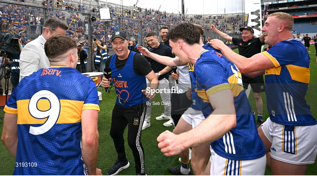 20 July 2025; Tipperary manager Liam Cahill turns to celebrate with his players as he is being interviewed by BBC after the GAA Hurling All-Ireland Senior Championship final match between Cork and Tipperary at Croke Park in Dublin. Photo by Seb Daly/Sportsfile