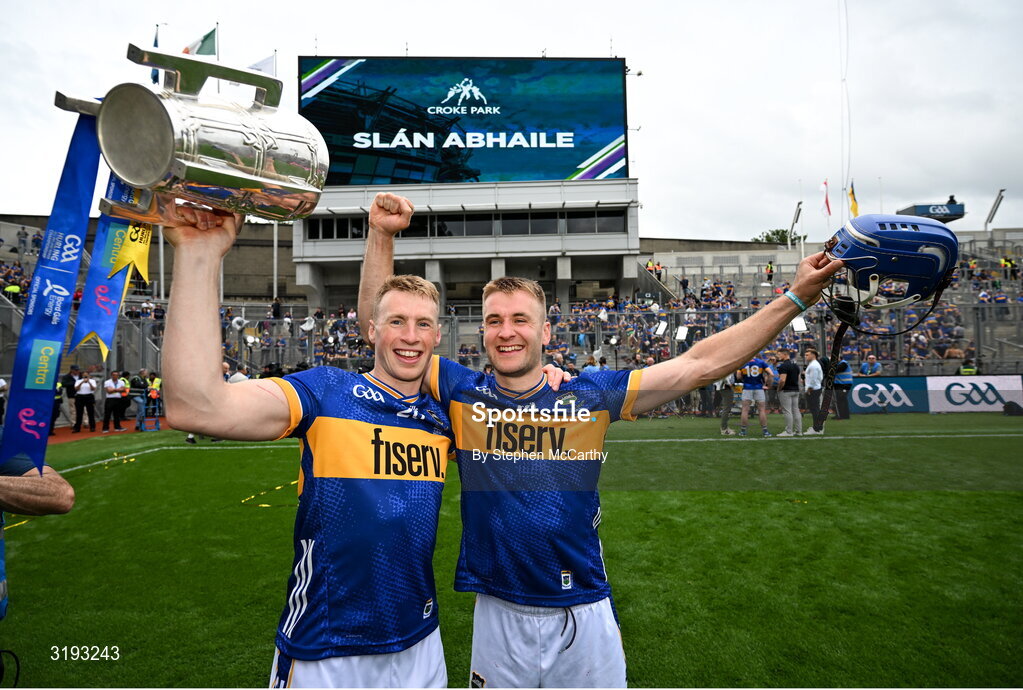 20 July 2025; Brian McGrath, left, and John McGrath of Tipperary celebrates with the Liam MacCarthy cup after their side's victory in the GAA Hurling All-Ireland Senior Championship final match between Cork and Tipperary at Croke Park in Dublin. Photo by Stephen McCarthy/Sportsfile