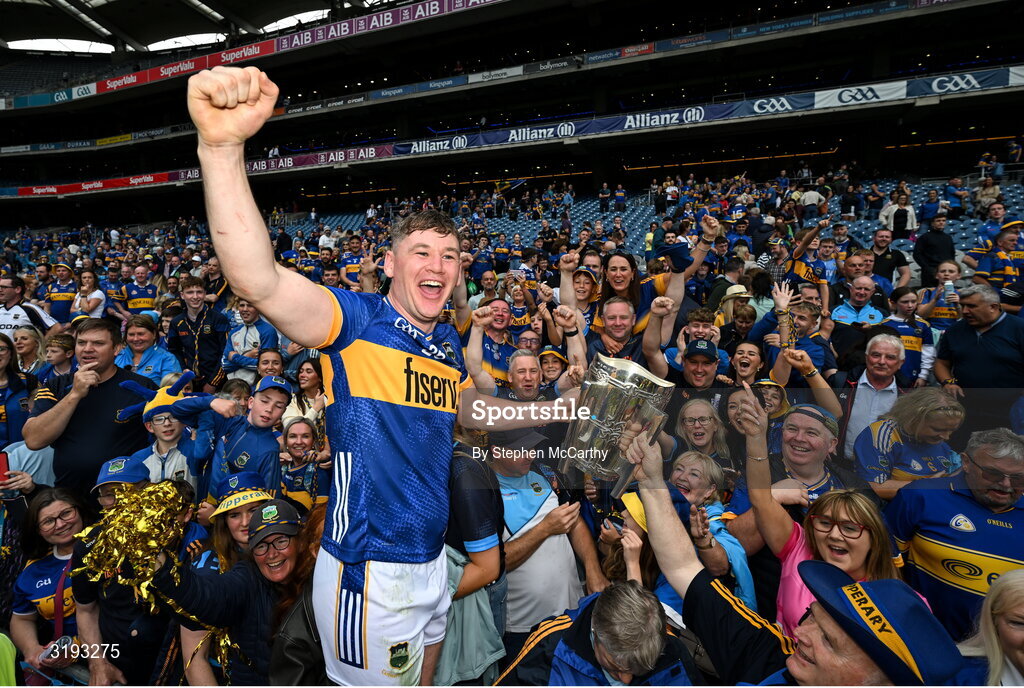 20 July 2025; Alan Tynan of Tipperary and supporter celebrates with the Liam MacCarthy cup after their side's victory in the GAA Hurling All-Ireland Senior Championship final match between Cork and Tipperary at Croke Park in Dublin. Photo by Stephen McCarthy/Sportsfile